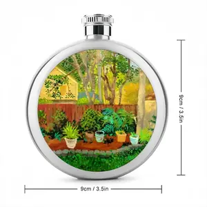 Backyard Garden With Yellow House Flagon