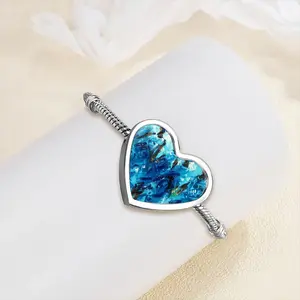 Women In Blue Heart Shaped Nnake Bone Bracelet