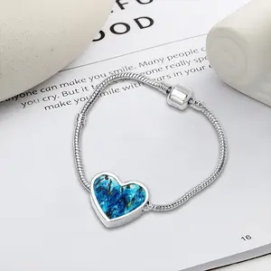 Women In Blue Heart Shaped Nnake Bone Bracelet